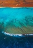 Vue aérienne sur Ningaloo avec les nuances de couleurs entre l'outback, la plage et les eaux